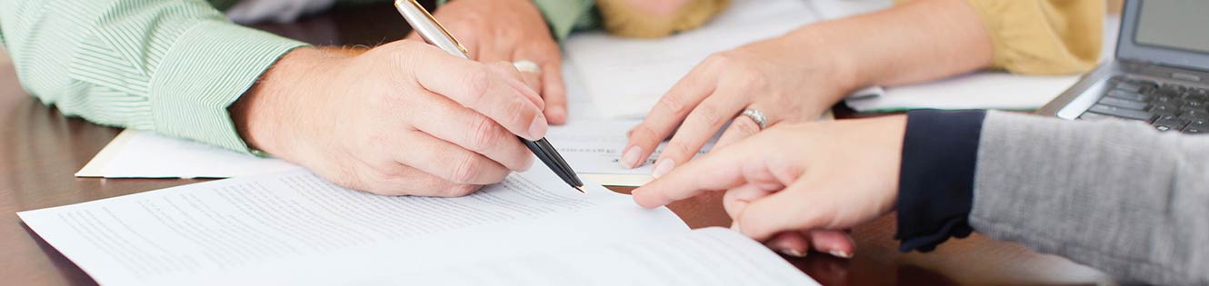 couple signing documents