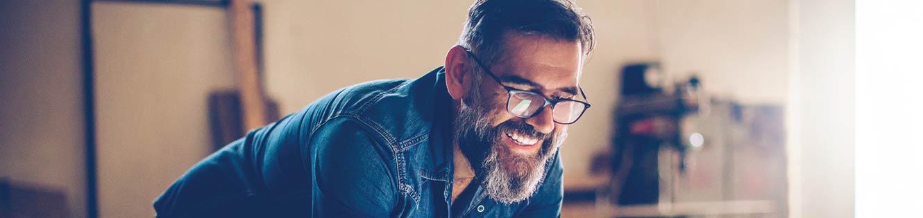 man with glasses smiling