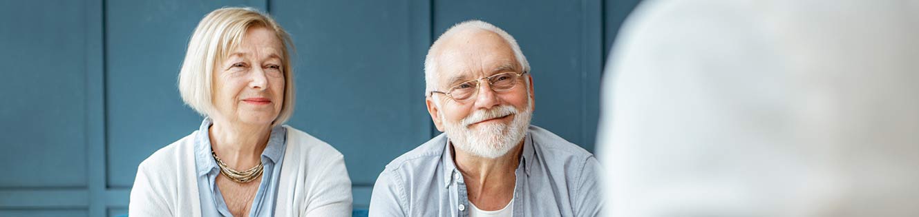 elderly couple smiling