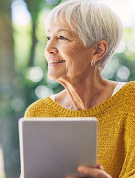 Woman checking bank balance on a laptop.