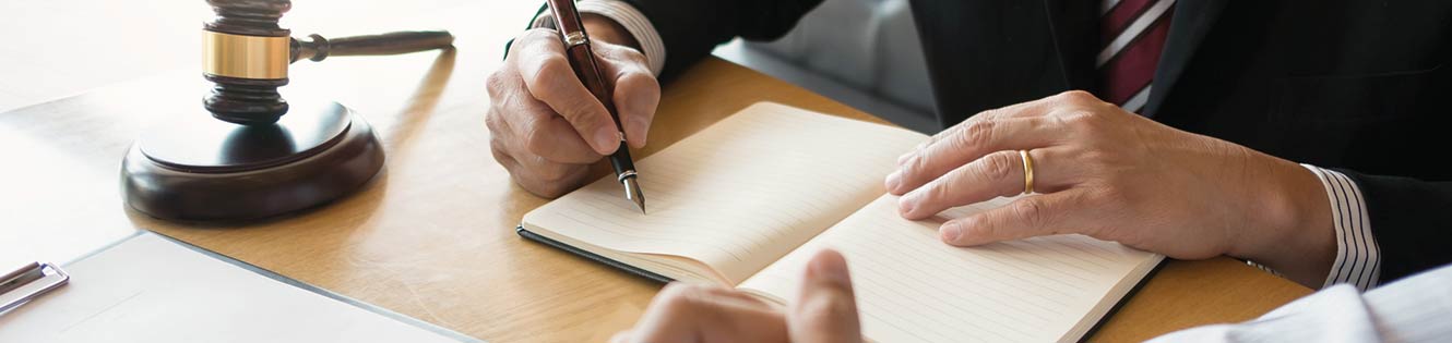 person signing a document